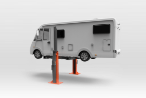 A motorhome is elevated on two orange jack stands, against a gradient white background.