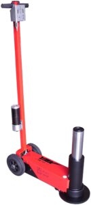 A red hydraulic floor jack with a vertical handle and black wheels against a white background, showcasing no explicit action.