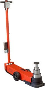 A red hydraulic floor jack with a vertical lifting arm against a white background, typically used for lifting vehicles for maintenance.