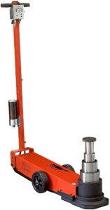 An orange hydraulic floor jack with a vertically mounted gauge, positioned against a white background.