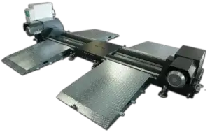 A metallic automotive lift with ramps and platforms, designed for raising vehicles, in a workshop or garage setting without additional context.