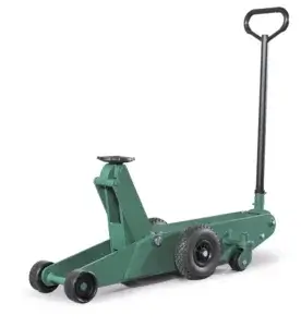 Green floor jack with four wheels and an upright handle, designed for lifting vehicles, positioned isolated on a white background.