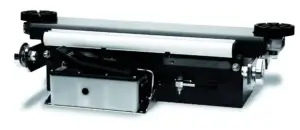 A cylindrical roller with black end supports is mounted on a black base, suggesting industrial or printing equipment, isolated on a white background.