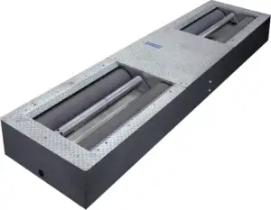 A shoe cleaning machine with brushes inside a rectangular casing, resting on a flat surface.